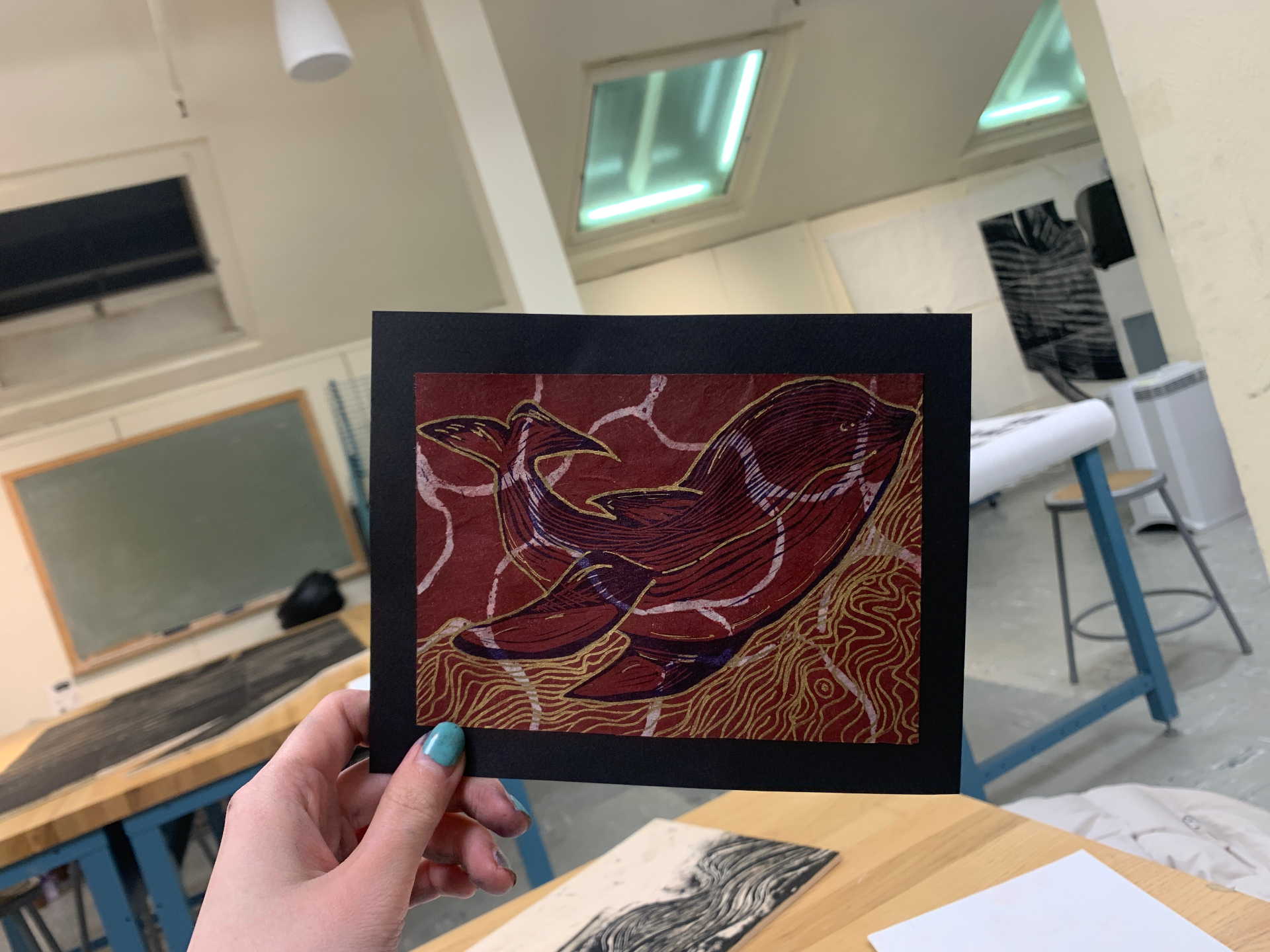 Whale on crimson — Reduction linocut with gold ink